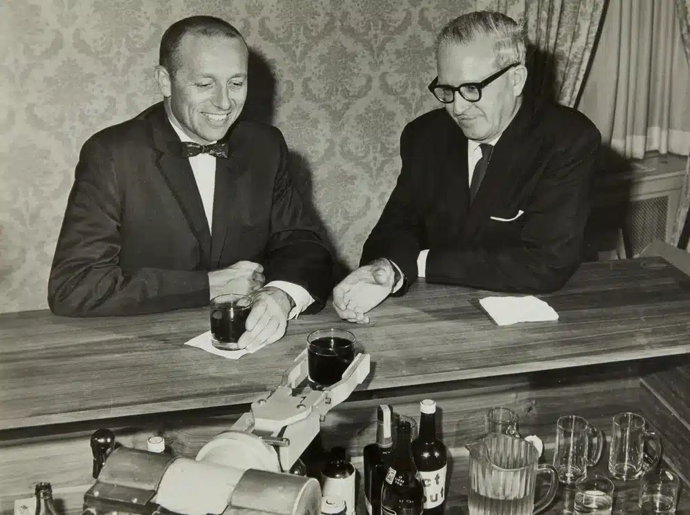 Who invented robots: George Devol and Joseph Engelberger being served drinks by a robotic arm